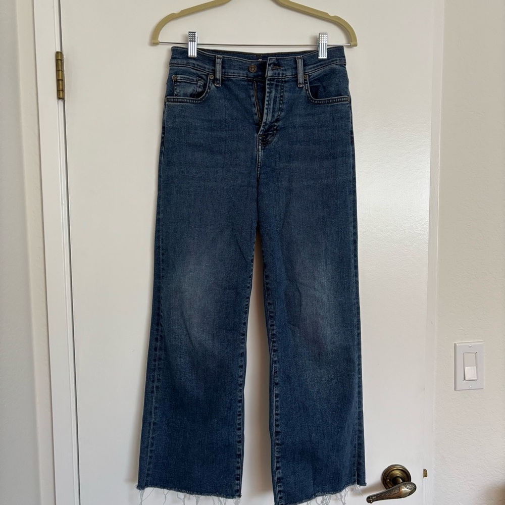 7 for all mankind cropped wide leg jeans in medium blue wash with raw hem